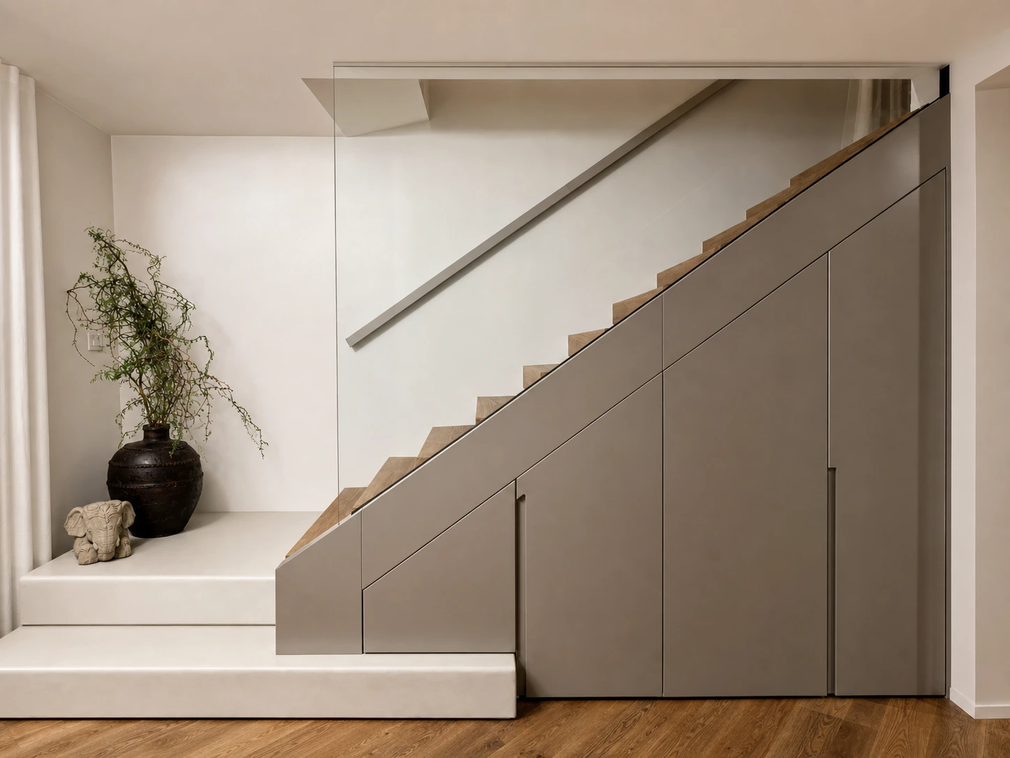 Photograph of a cabinet following the slope of the stairs